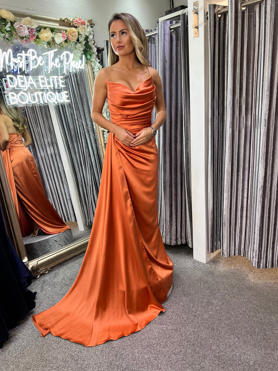 Suki satin side train full length prom dress orange Deja Elite Boutique Suki satin side train full length prom dress orange Deja Elite Boutique