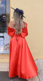 Kris satin midi dress with removable over skirt by Kevan Jon tangerine