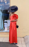 Kris satin midi dress with removable over skirt by Kevan Jon tangerine
