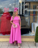 Kristina flare dip hem midi dress by Kevan Jon in hot pink