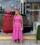 Kristina flare dip hem midi dress by Kevan Jon in hot pink