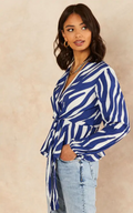 Zebra print blue and white wrap blouse