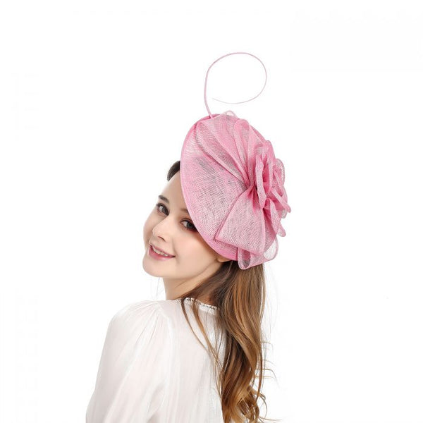 Baby pink fascinator with flower and quill detail