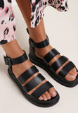 ‘Make a stand ‘buckle gladiator sandals - black