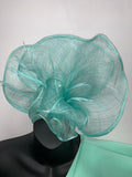 Mint green sinimay loop and feather fascinator